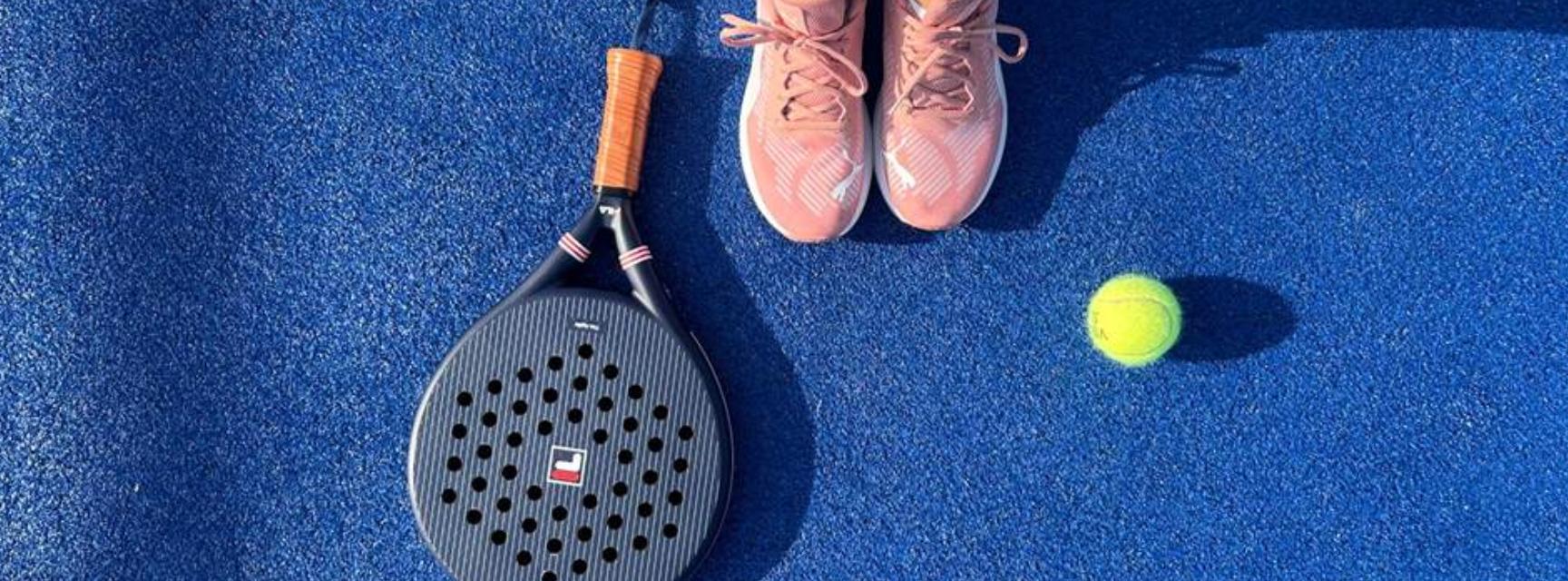 A padel racket and ball