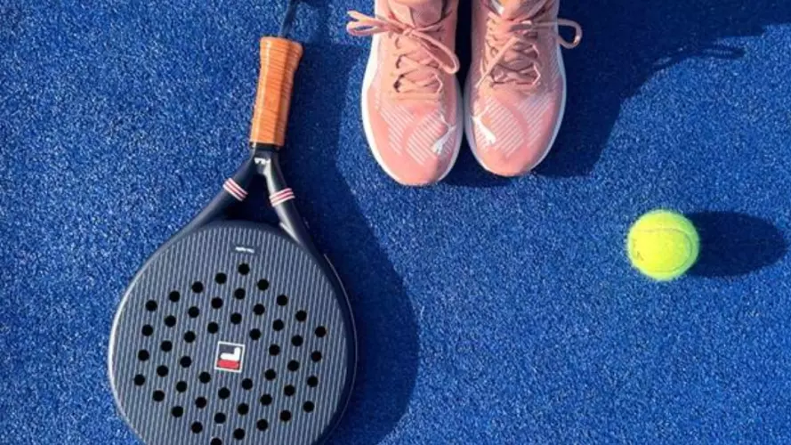 A padel racket and ball