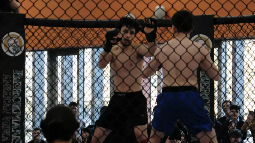 An MMA walking around the octagonal ring